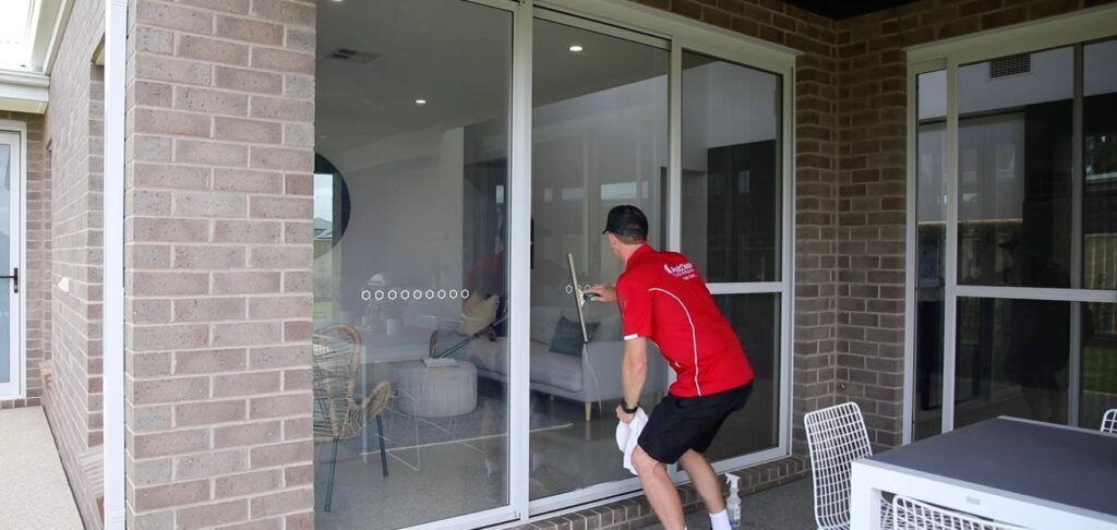 AustClean professional service van parked at residential property – mobile cleaning franchise offering domestic, commercial, exterior, and carpet cleaning services across Australia with branded vehicle displaying contact information.