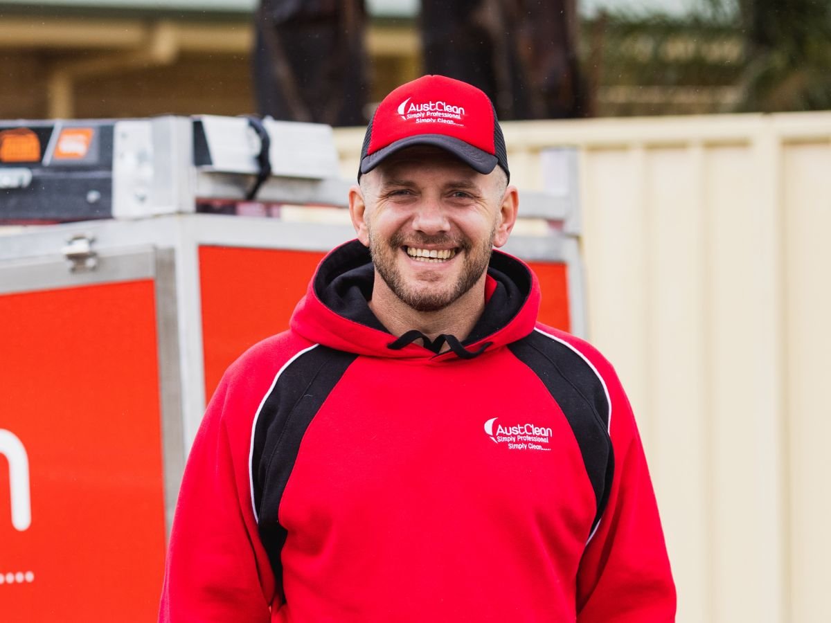 Commercial Cleaning Checklist for Swan Hill Retail & Office Spaces 1 Friendly AustClean cleaning technician in company uniform and cap, representing professional and reliable cleaning services for homes and businesses across Australia.