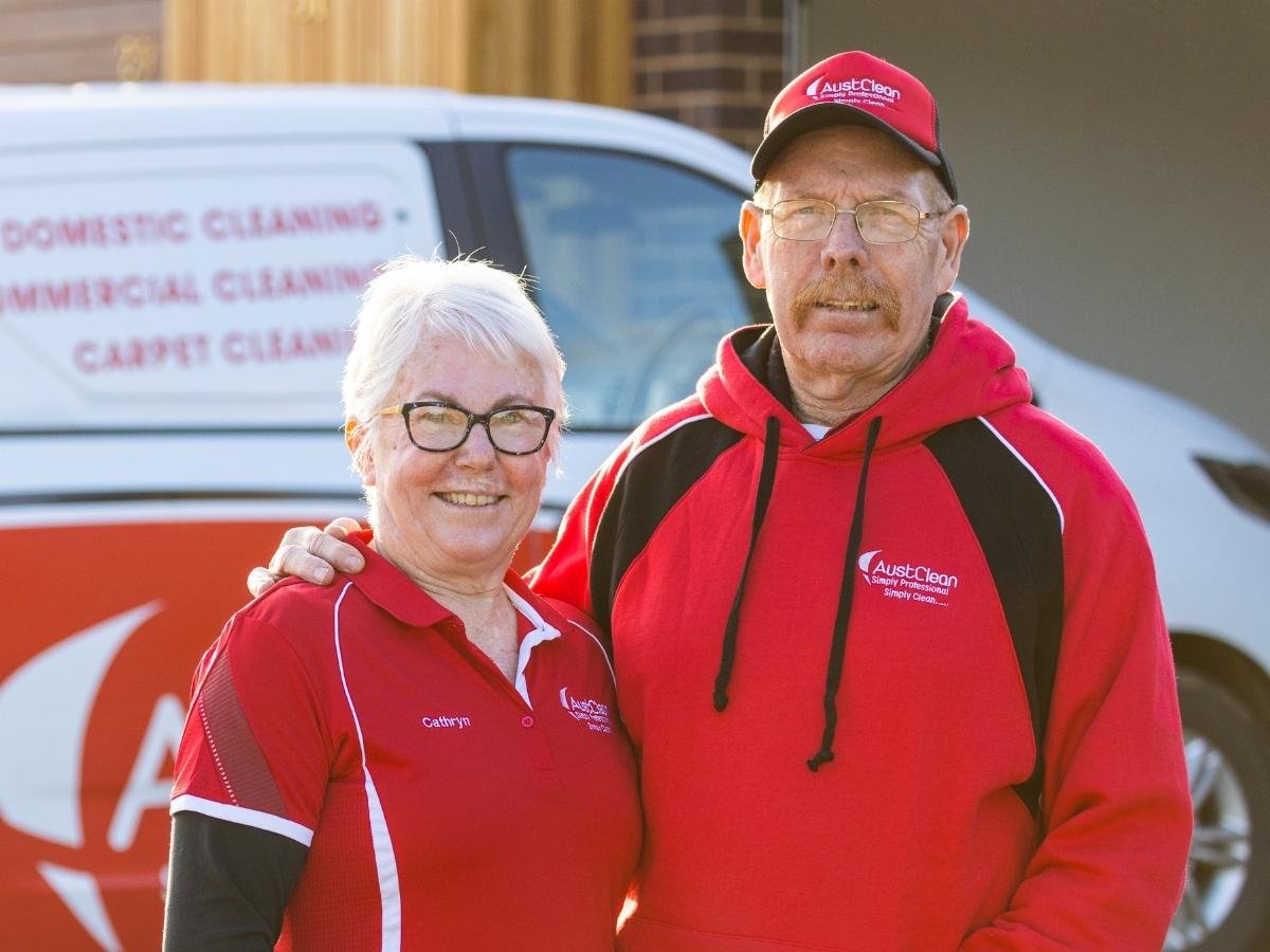 Echuca Cleaning Services 3 Professional AustClean cleaning team - male and female technicians in uniform standing with service van, representing experienced and diverse cleaning professionals across Australia.