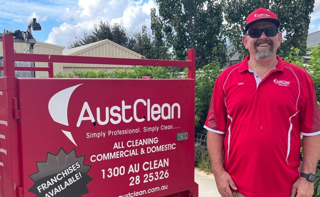 Mildura Interior Cleaning Services 1 AustClean professional franchise team member in branded uniform showcasing AustClean mobile cleaning equipment and franchise opportunities - expert exterior cleaning services across Queensland and Australia with local franchise support
