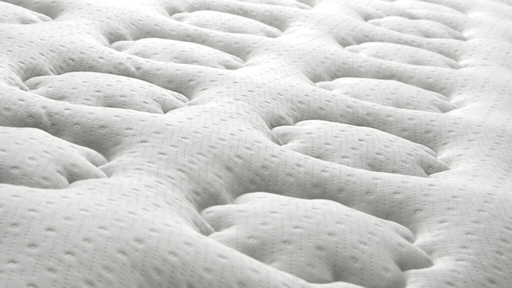 Professional mattress cleaning services by AustClean - deep stain removal and sanitization for white quilted mattresses in Australia