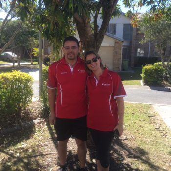 Merrimac Worongary & Surrounds 11 AustClean Tallai team – professional husband and wife cleaning duo in matching red AustClean shirts, representing trusted carpet cleaning and interior cleaning services in the Gold Coast Tallai area.